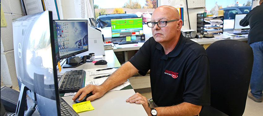 man in office on computer